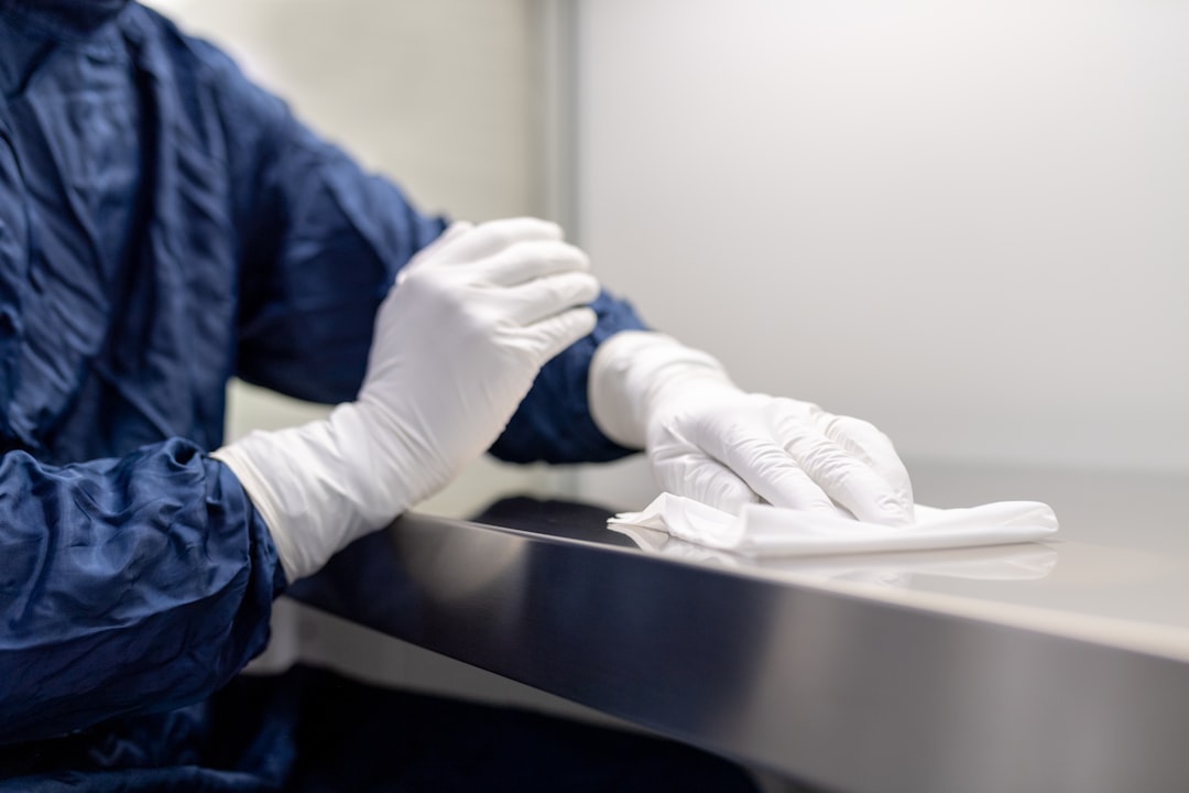 Laboratory personnel cleaning laboratory